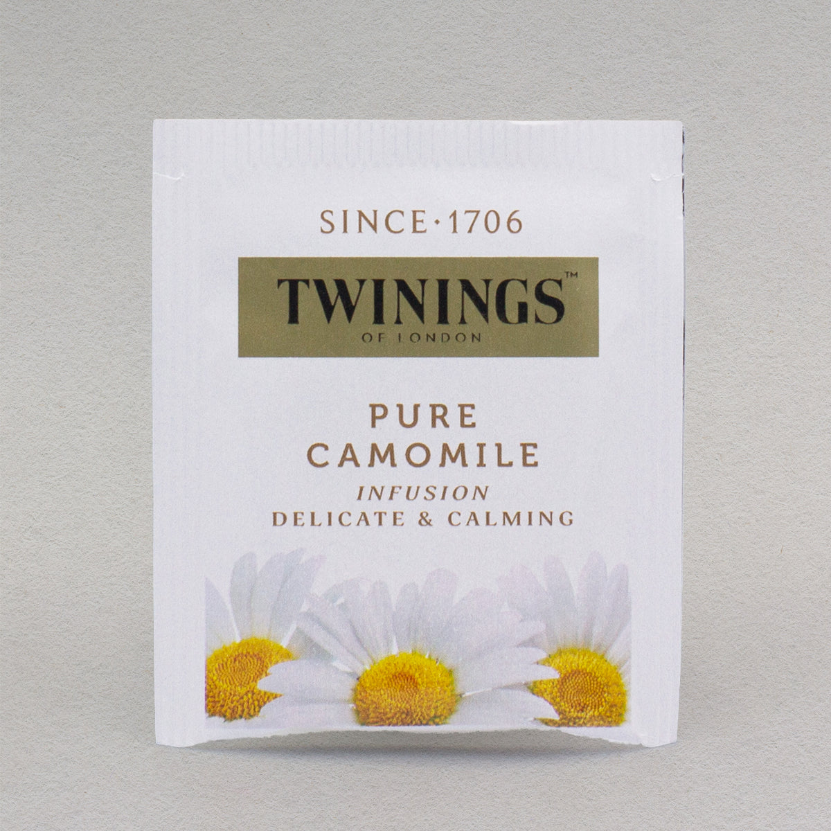 A single Twinings Pure Camomile tea bag in its packaging.