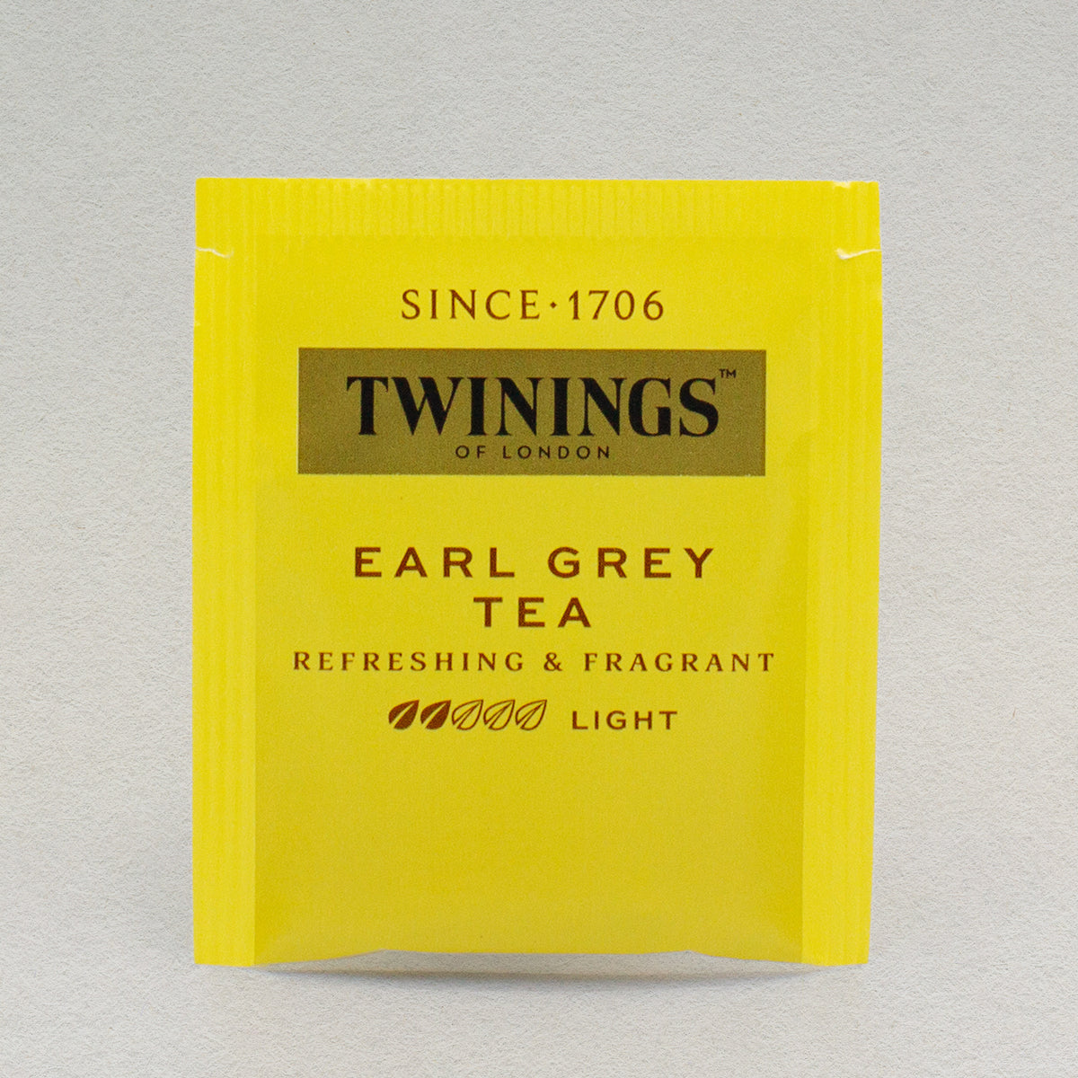 A single Twinings Earl Grey tea bag in its packaging.