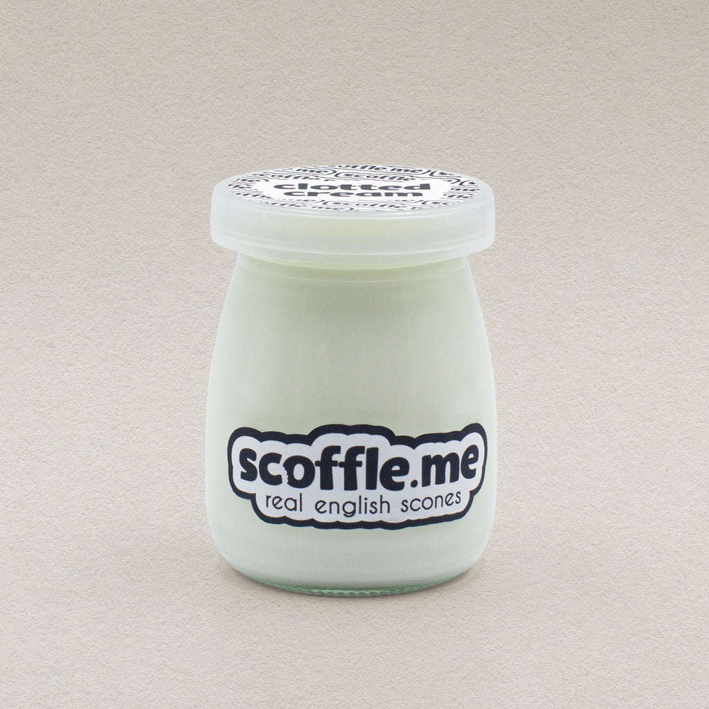 A retro looking 100ml glass jar of Scoffle Me branded homemade clotted cream.
