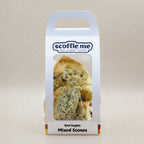 A cute white branded cardboard carrier with a handle and a clear display window showcasing four different flavoured scones.
