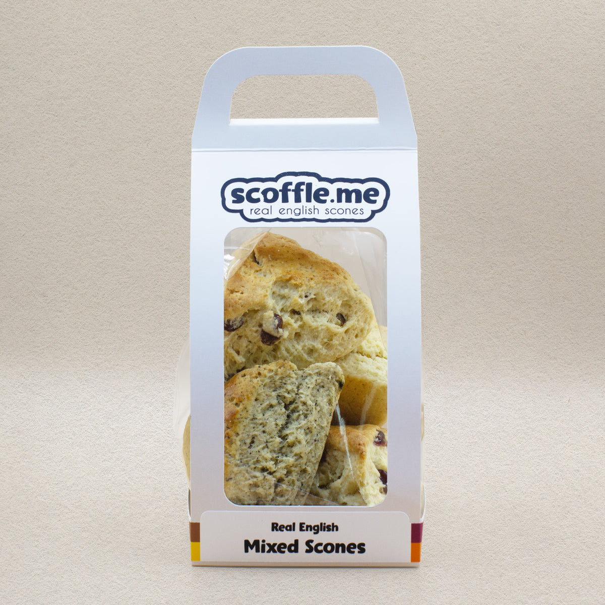 A cute white branded cardboard carrier with a handle and a clear display window showcasing four different flavoured scones.
