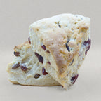 Two traditional English scones bursting with juicy dried cranberries.