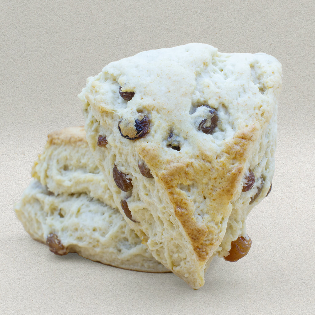 Two traditional English scones bursting with juicy dried raisins. 